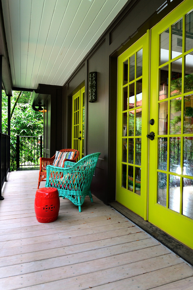 Inspiration for an eclectic porch remodel in Houston with decking