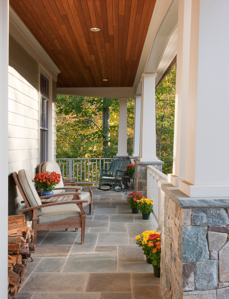 Design ideas for a medium sized traditional front veranda in DC Metro with a roof extension.