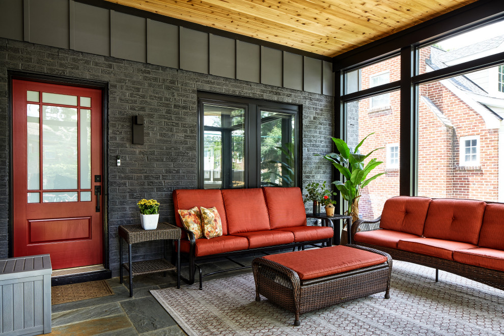 Imagen de porche cerrado contemporáneo de tamaño medio en patio delantero y anexo de casas con adoquines de piedra natural