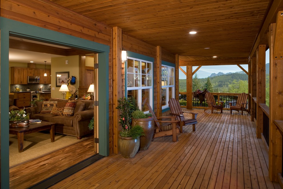 Mountain style porch idea in Seattle with decking
