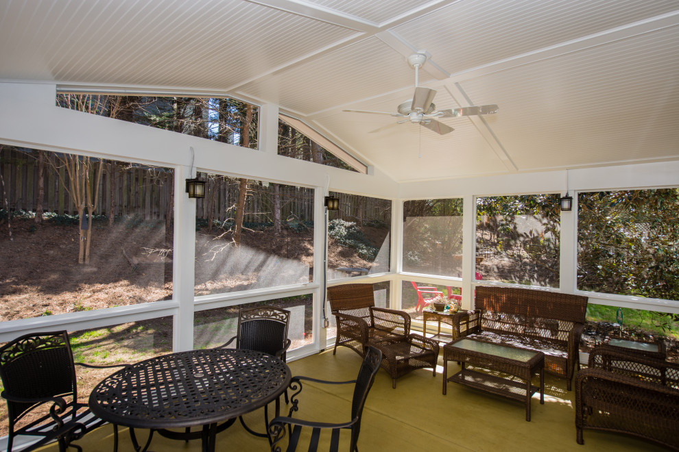 Mid-sized elegant screened-in back porch photo in Atlanta with a roof extension