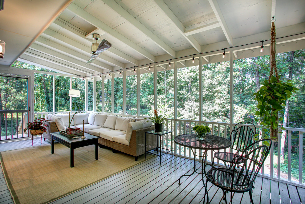 Huge transitional back porch idea in Atlanta with decking and a roof extension