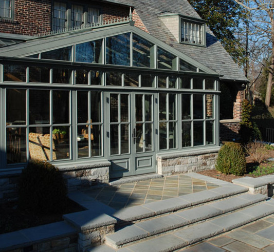 This is an example of a traditional back veranda in Other with a roof extension.