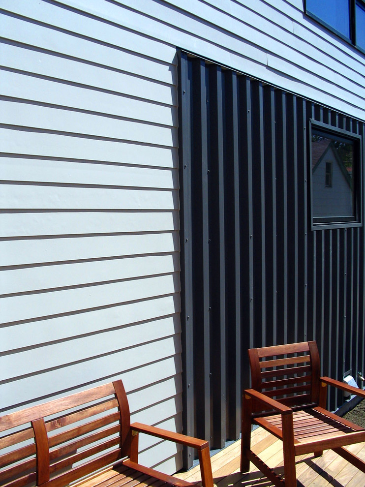 This is an example of a modern back veranda in Minneapolis with decking.