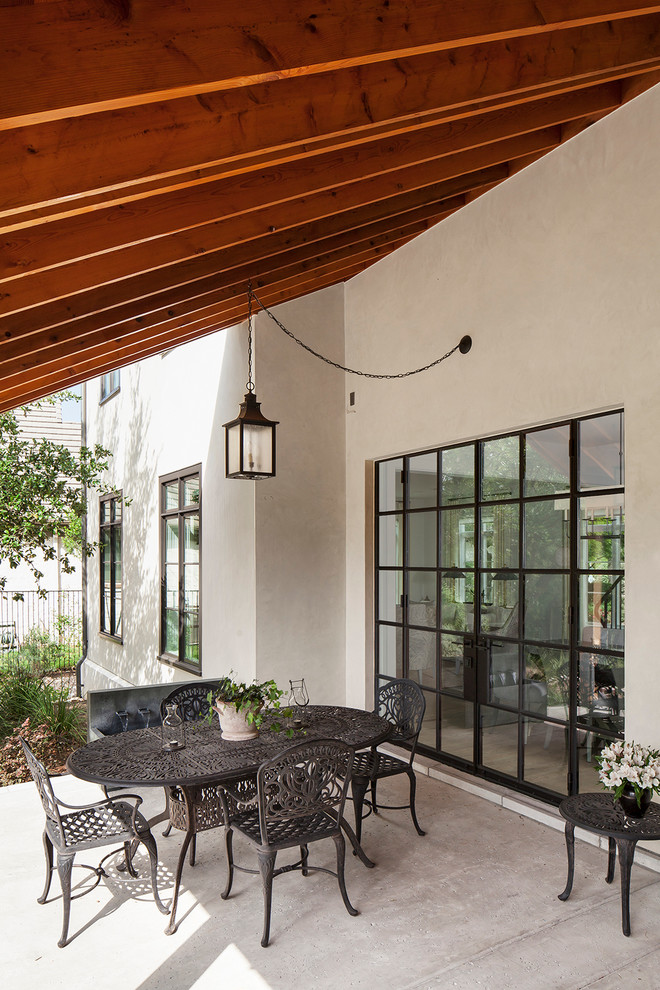 Traditional veranda in Austin with a roof extension and feature lighting.