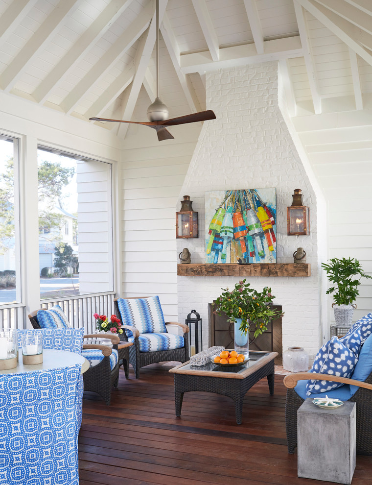 This is an example of a coastal porch design in Atlanta.
