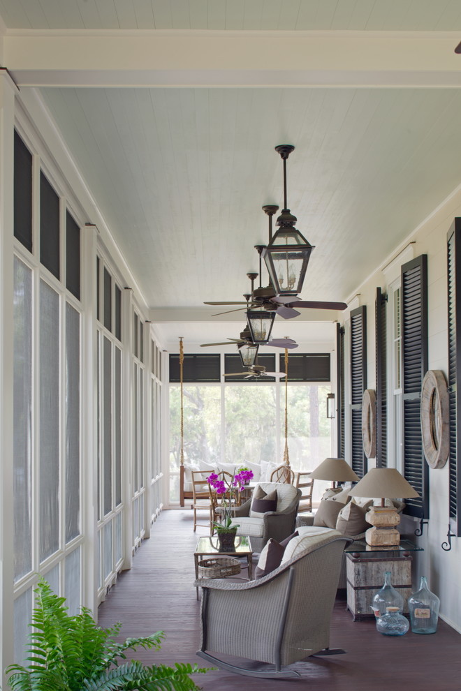 Inspiration for a beach style veranda in Charleston with feature lighting.