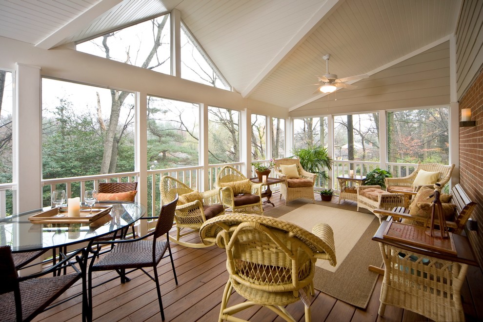Large elegant screened-in back porch photo in Baltimore with decking and a roof extension