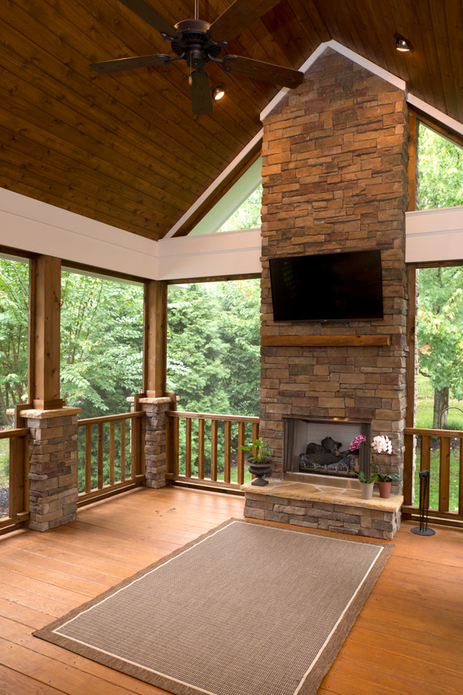 Mid-sized mountain style screened-in back porch idea in Charlotte with decking and a roof extension