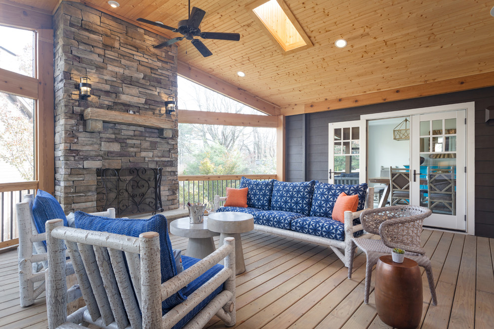 Large bohemian back veranda in Charlotte with a fire feature, decking and a roof extension.