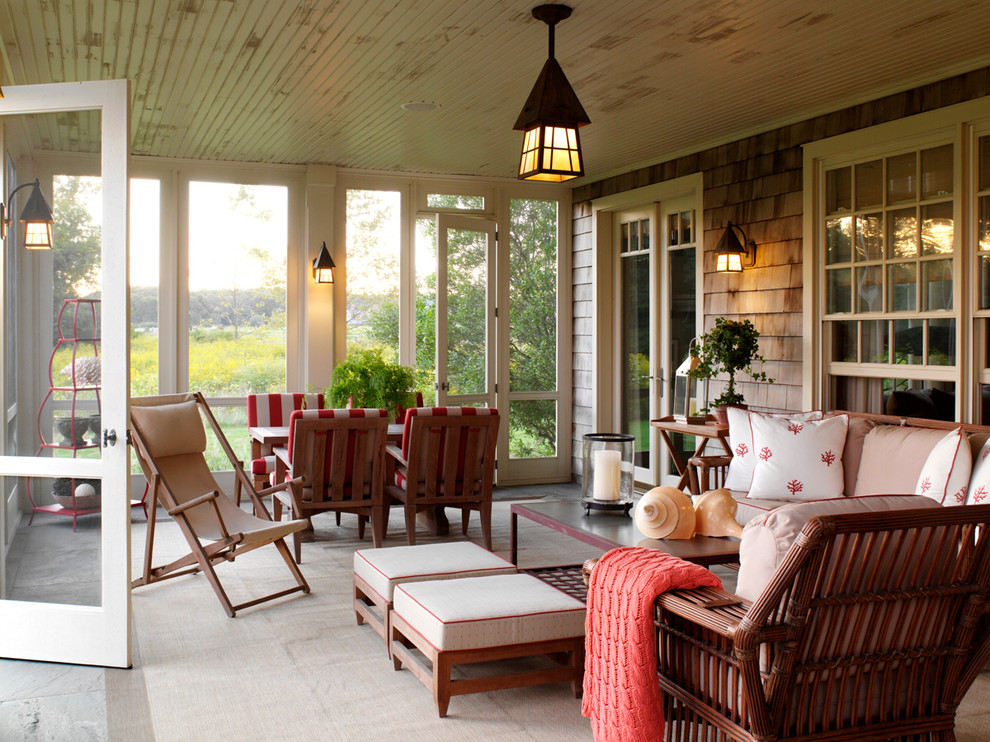 Photo of a traditional veranda in New York with feature lighting and all types of cover.