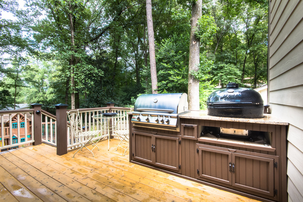 Photo of a large rural back veranda in Atlanta with an outdoor kitchen.