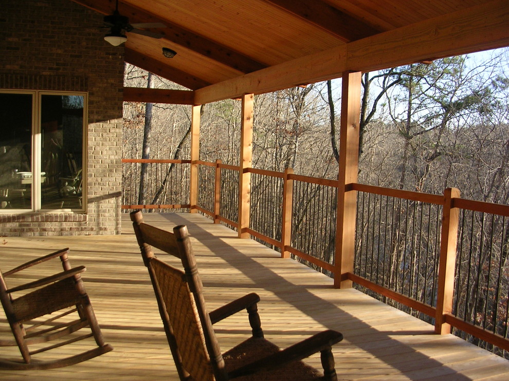 This is an example of a large rustic back porch design in Birmingham with decking and a roof extension.