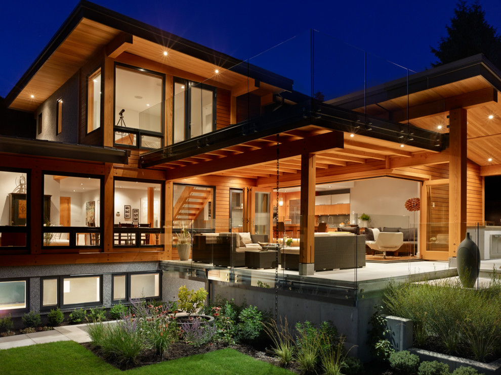 Idée de décoration pour un porche d'entrée de maison arrière design avec une dalle de béton et une extension de toiture.