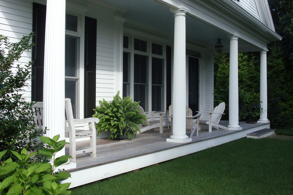 Inspiration for a timeless porch remodel in Boston with decking and a roof extension