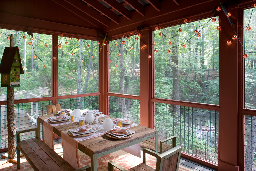 Inspiration for a rustic screened-in porch remodel in Atlanta