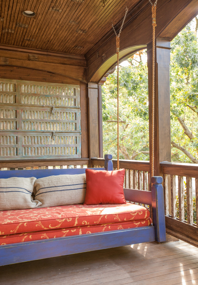 Mountain style porch photo in Dallas with decking and a roof extension