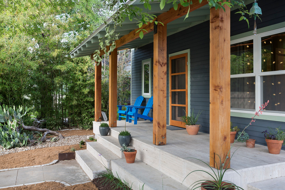 Mid-sized trendy front porch idea in Austin with a roof extension