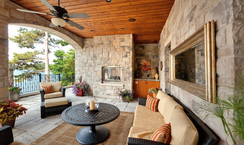 Inspiration for a mediterranean porch remodel in Philadelphia with a fire pit