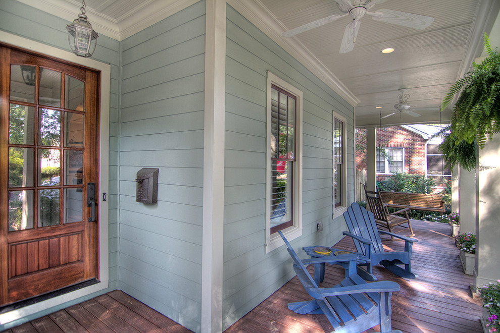 This is an example of a classic front veranda in Charlotte with decking and a roof extension.