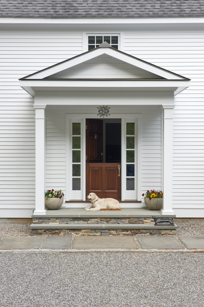 This is an example of a cottage porch design in New York.
