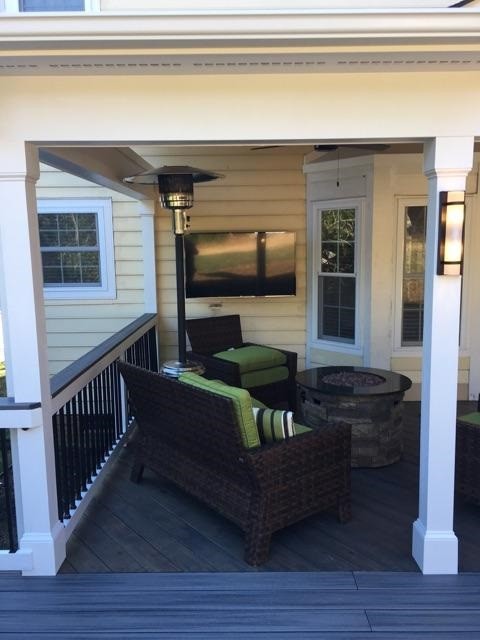 This is an example of a rustic porch design in Charlotte.