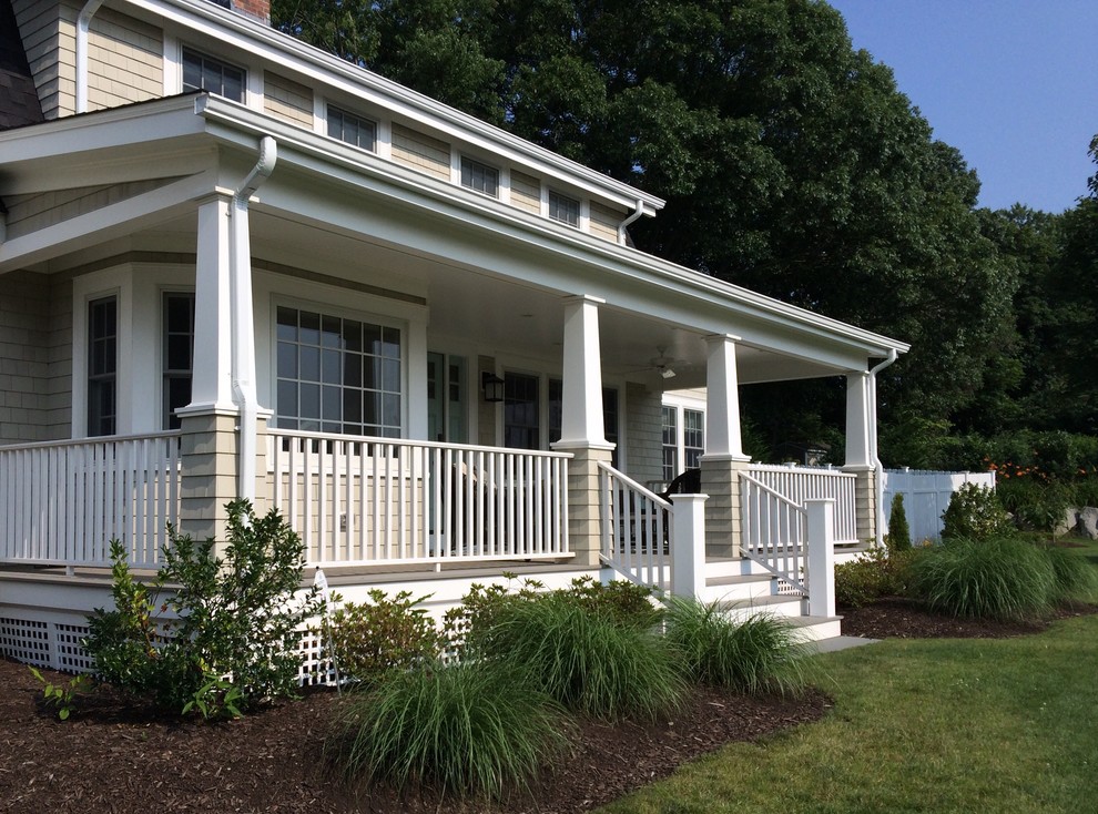 Inspiration for a large rural front veranda in Providence with decking and a roof extension.