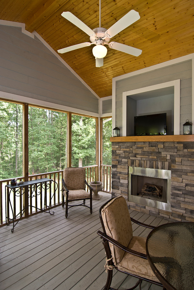 Inspiration for a timeless porch remodel in Charlotte with a fire pit, decking and a roof extension