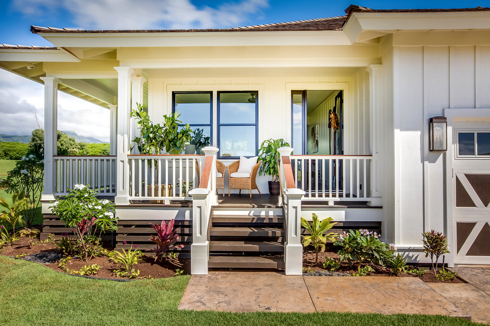 Medium sized coastal front veranda in Hawaii with decking and a roof extension.