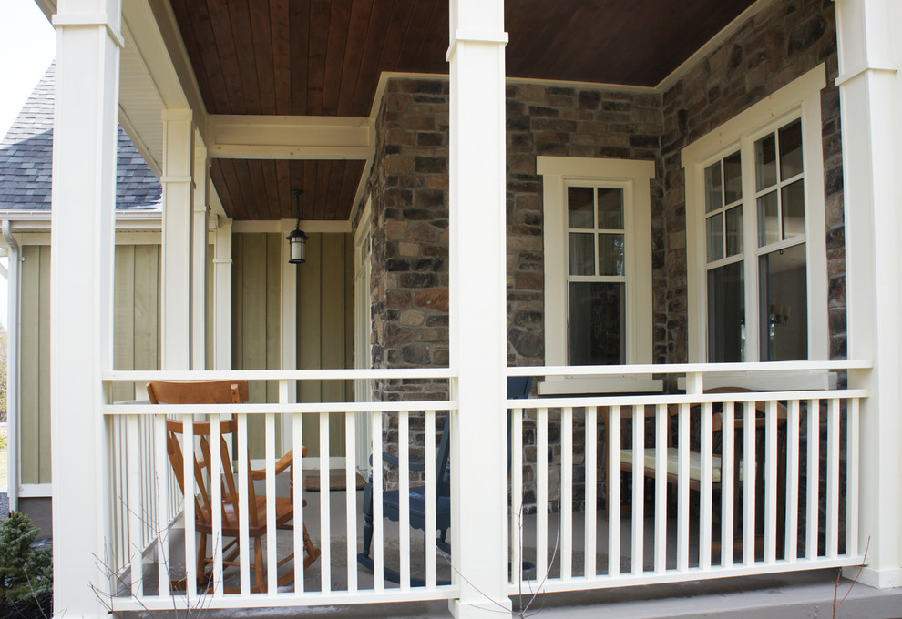 Mid-sized arts and crafts front porch idea in Ottawa