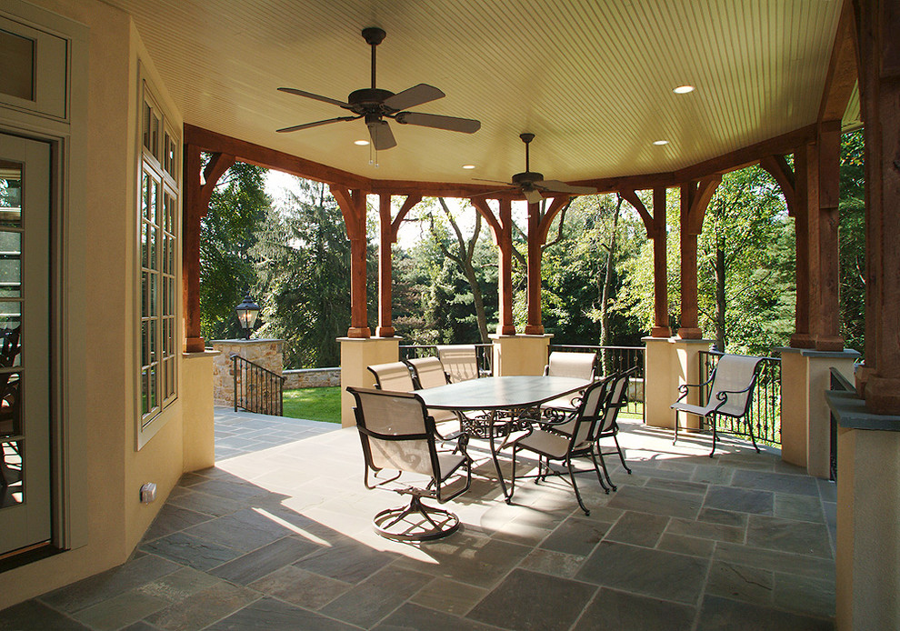 Traditional back veranda in Philadelphia with natural stone paving.