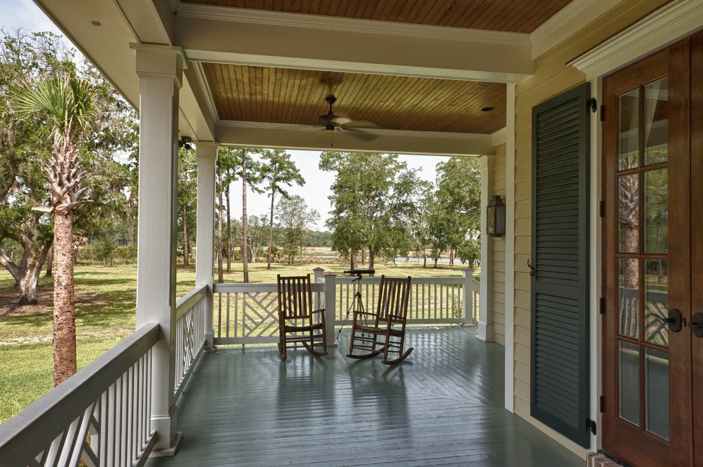 Large classic side veranda in Charleston with decking and a roof extension.