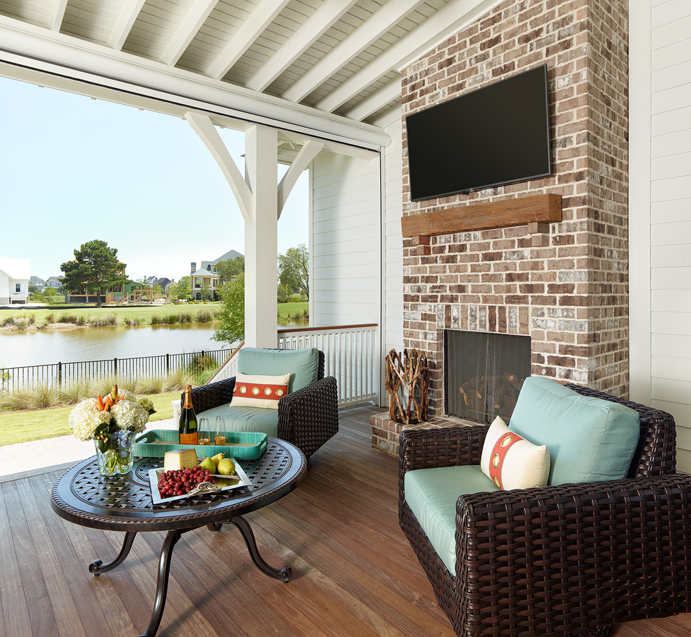Transitional porch idea in Charleston with decking and a roof extension