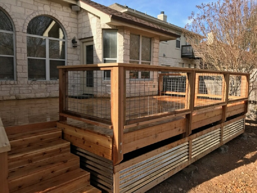 Mid-sized trendy back porch idea in Austin with decking