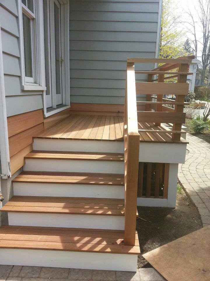 Small classic back porch idea in Boston with decking