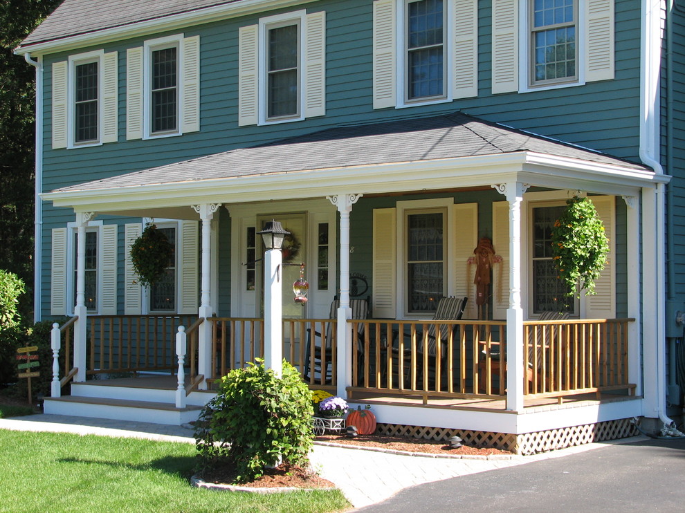 Elegant porch photo in Boston with decking and a roof extension