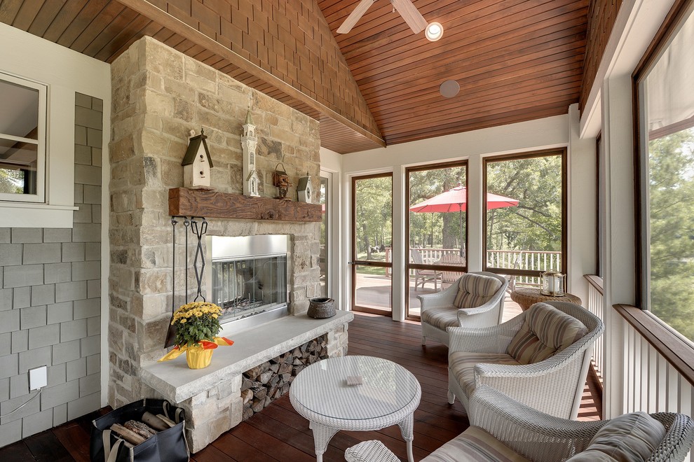 Elegant porch photo in Minneapolis with a fire pit, decking and a roof extension