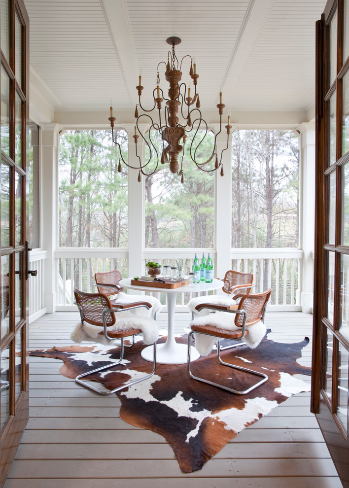 This is an example of a large traditional back porch design in Atlanta with decking and a roof extension.