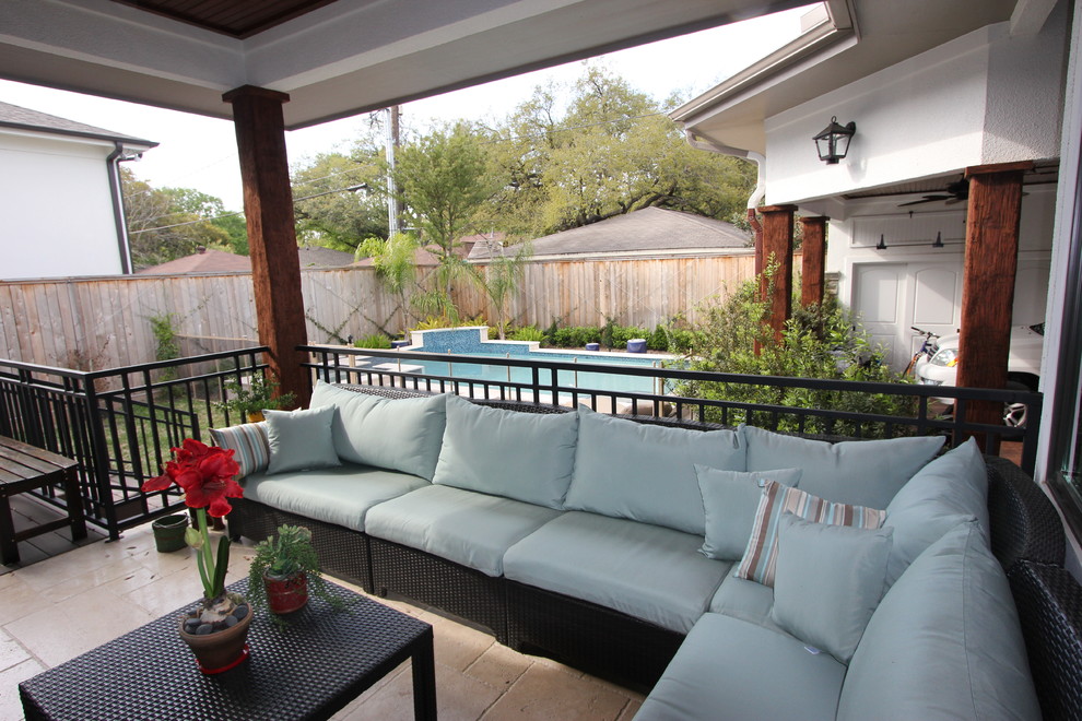 This is an example of a transitional porch design in Houston.