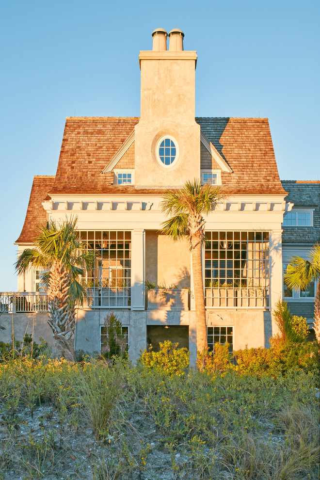 This is an example of a coastal porch design in Charleston.