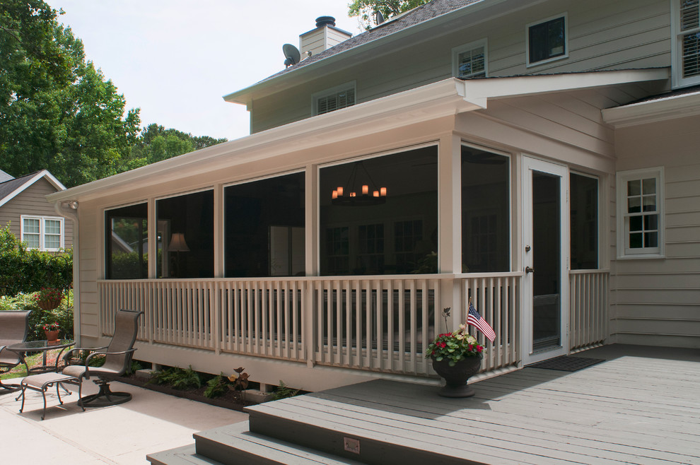 Inspiration for a large timeless screened-in back porch remodel in Atlanta with decking and a roof extension