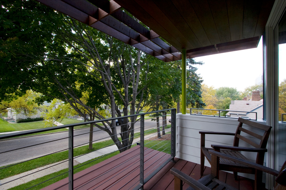 Inspiration for a modern front veranda in Minneapolis with a roof extension.