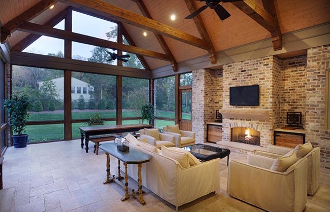 Huge mountain style tile screened-in back porch idea in Nashville with a roof extension