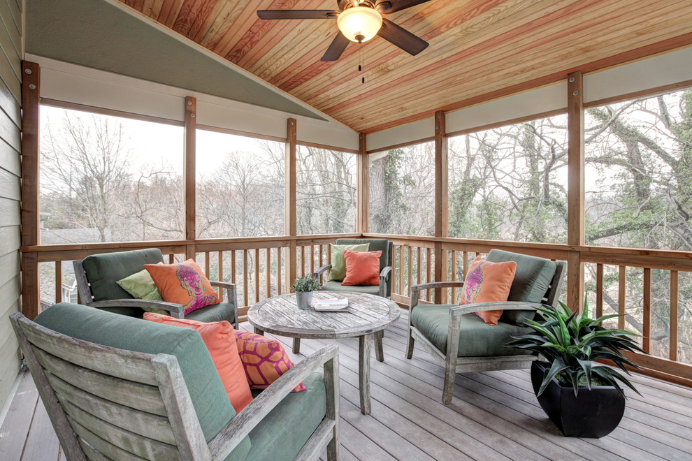 Large classic screened-in back porch idea in DC Metro with decking and a roof extension
