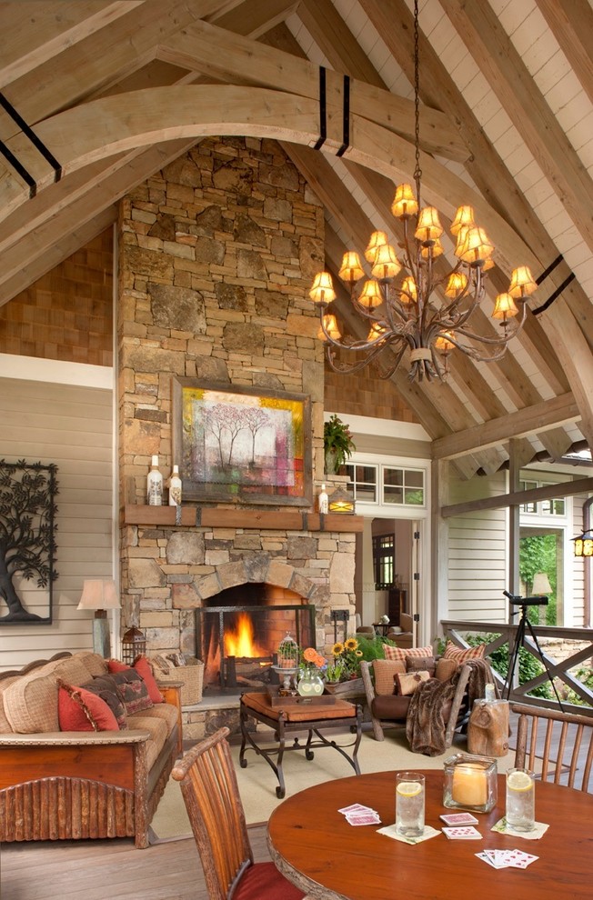 Mid-sized elegant back porch photo in Nashville with a fire pit, a roof extension and decking