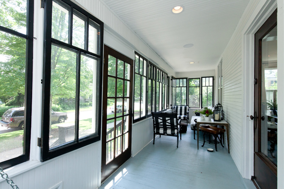 Small cottage screened-in front porch photo in Chicago with a roof extension