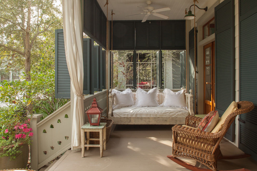 Cottage chic porch photo in Miami with a roof extension