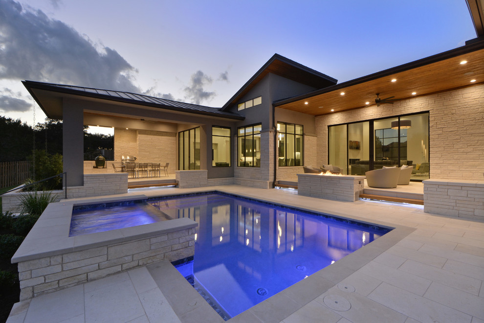 This is an example of a contemporary back veranda in Austin.