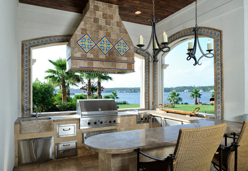 Stainless steel outdoor cabinet island beside polymer storage units