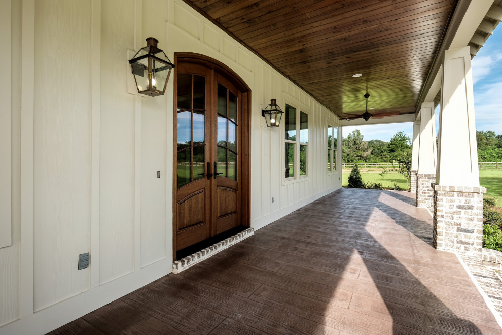 This is an example of a rural front veranda in New Orleans with a roof extension.